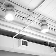 7 Common Air Duct Cleaning Questions Answered Clean air ducts in a well-lit and clean building hallway