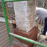 Historic brick home in Alexandria, VA with Sixpenny Chimney Sweeps inspecting the chimney for leaks and maintenance. Historic brick home in Alexandria, VA with Sixpenny Chimney Sweeps inspecting the chimney for leaks and maintenance.