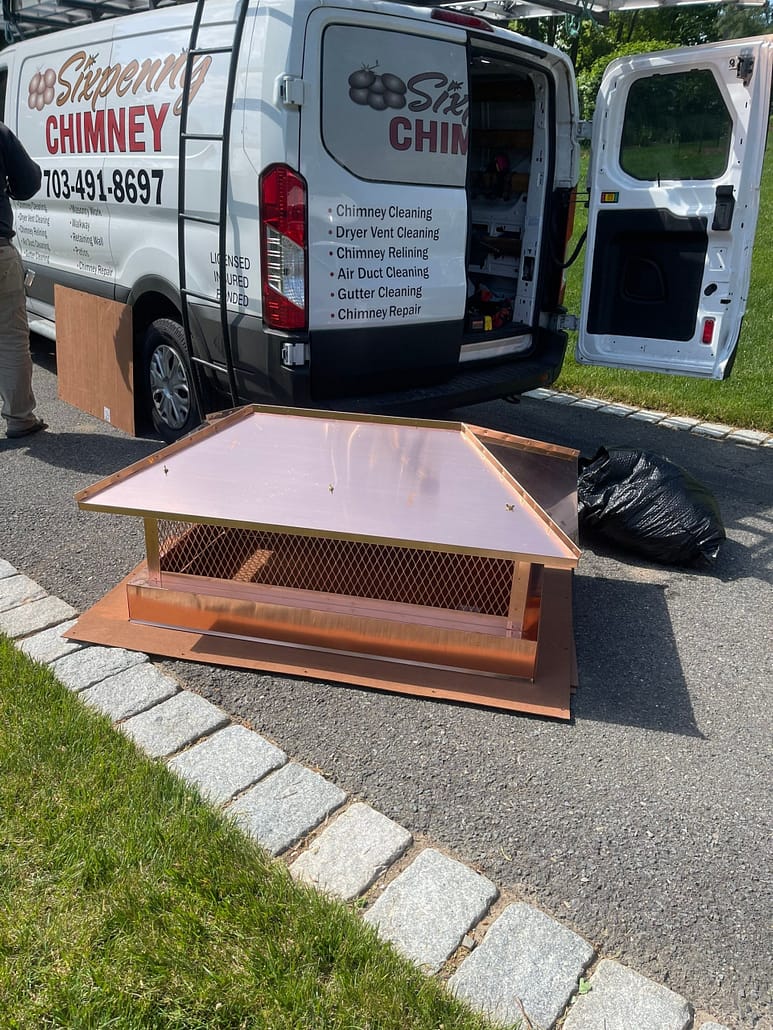 Copper Chimney Cap Installation McLean VA - Sixpenny Chimney Sweeps Copper Chimney Cap by Sixpenny Work Truck awaiting installation on Chimney